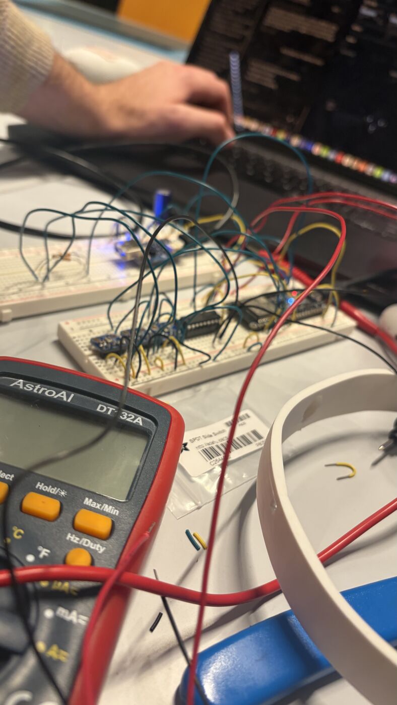 Breadboard wiring next to the first headband, and the first "DRONE OVERHEAD" on the dashboard