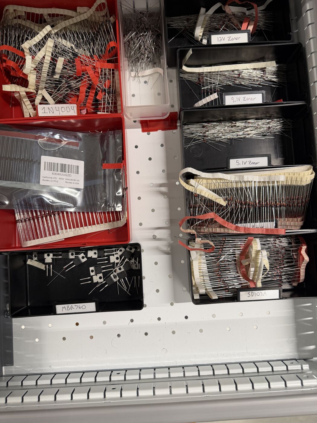 The SMD resistor book (no 33 Ω) and the lab's diode drawer, where D2's substitute came from
