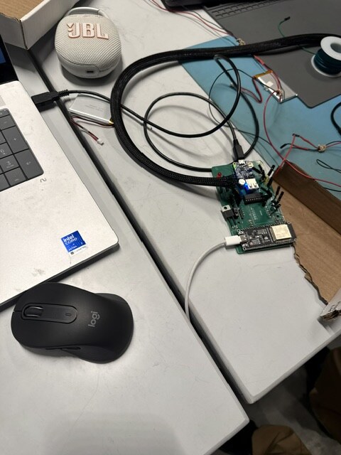 The harness in braided sleeving, the LiPo, and the speaker we used to replay drone audio