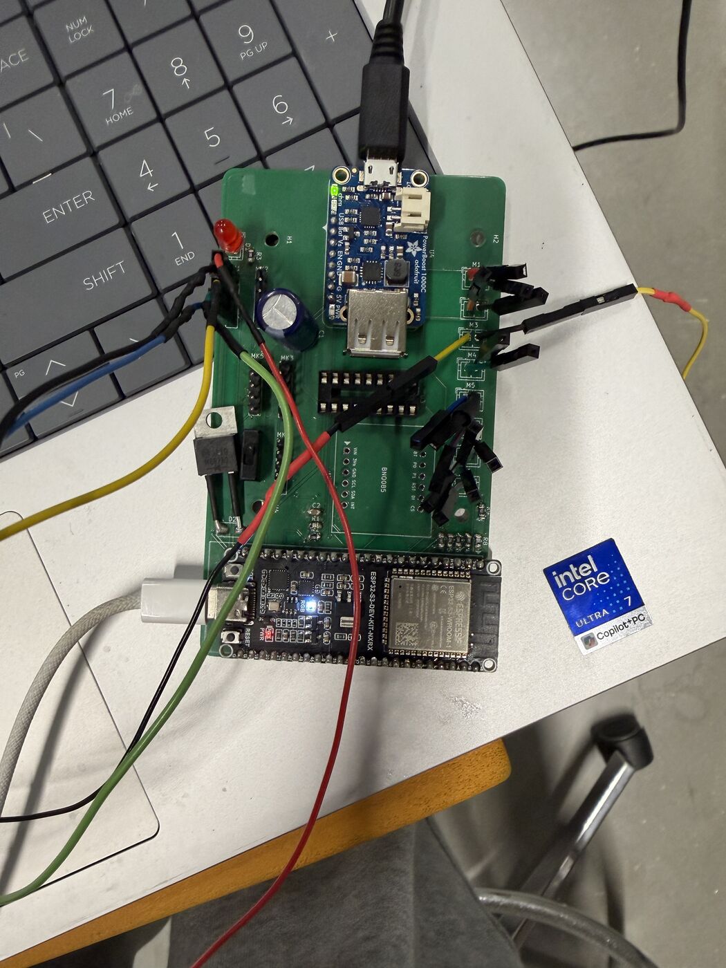 The populated carrier board, and first power-up with mic and motor leads attached